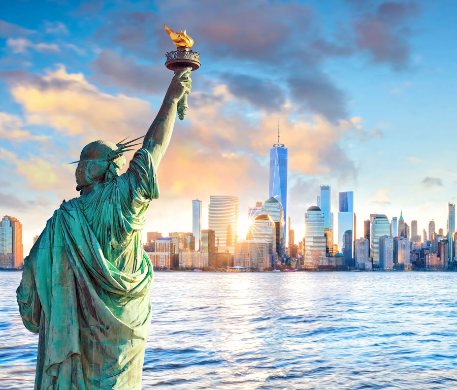 statue liberty new york city skyline sunset